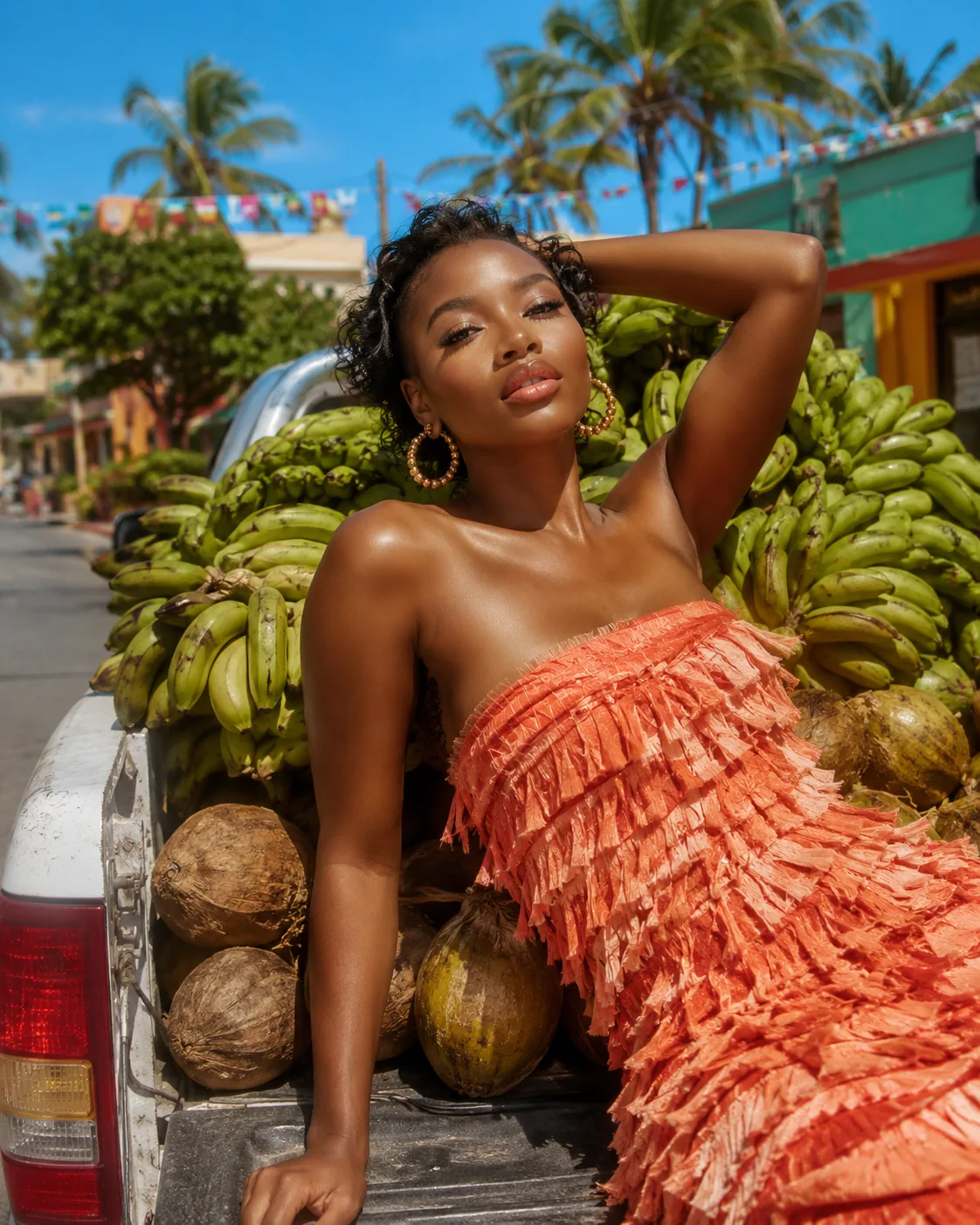 Editorial Summer Jam™ image — model surrounded by plantains and coconuts, the Caribbean memory behind the formula